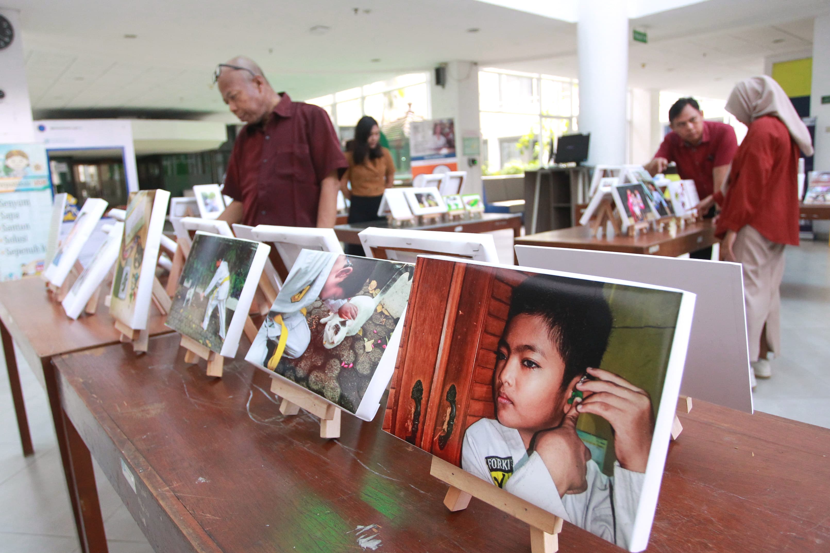 KESAN: Pameran Articurare yang menampilkan rangkaian fotografi dengan narasi yang ditampilkan oleh orang tua dan anak-anak yang menyandang kelainan penyakit langka.