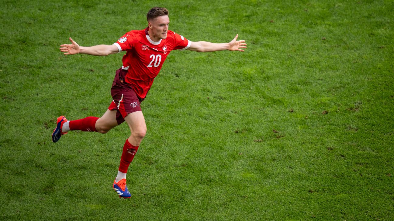 Selebrasi Michel Aebischer usai mencetak gol ke gawang Hungaria (getty)