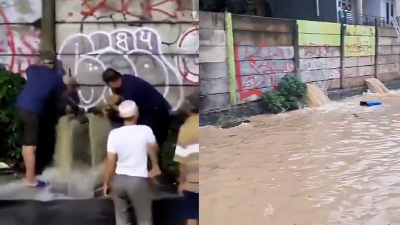 Sekelompok warga melakukan penjebolan tembok pembatas untuk kurangi banjir di Bekasi.
