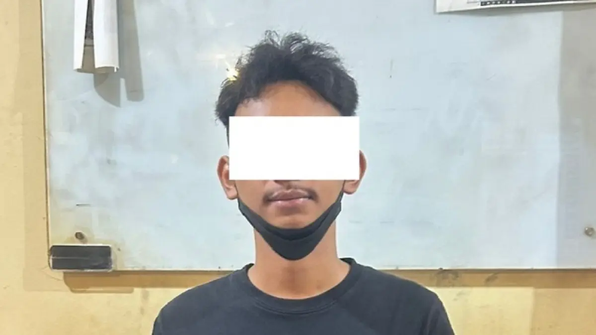 CAPTION:&nbsp;NH,23 salah satu pelaku dugaan penganiyaan pengendara sepeda motor di Jalan Kerto, Muja Muju, Umbulharjo saat diamankan pihak kepolisian. (DOKUMENTASI POLRESTA JOGJA)