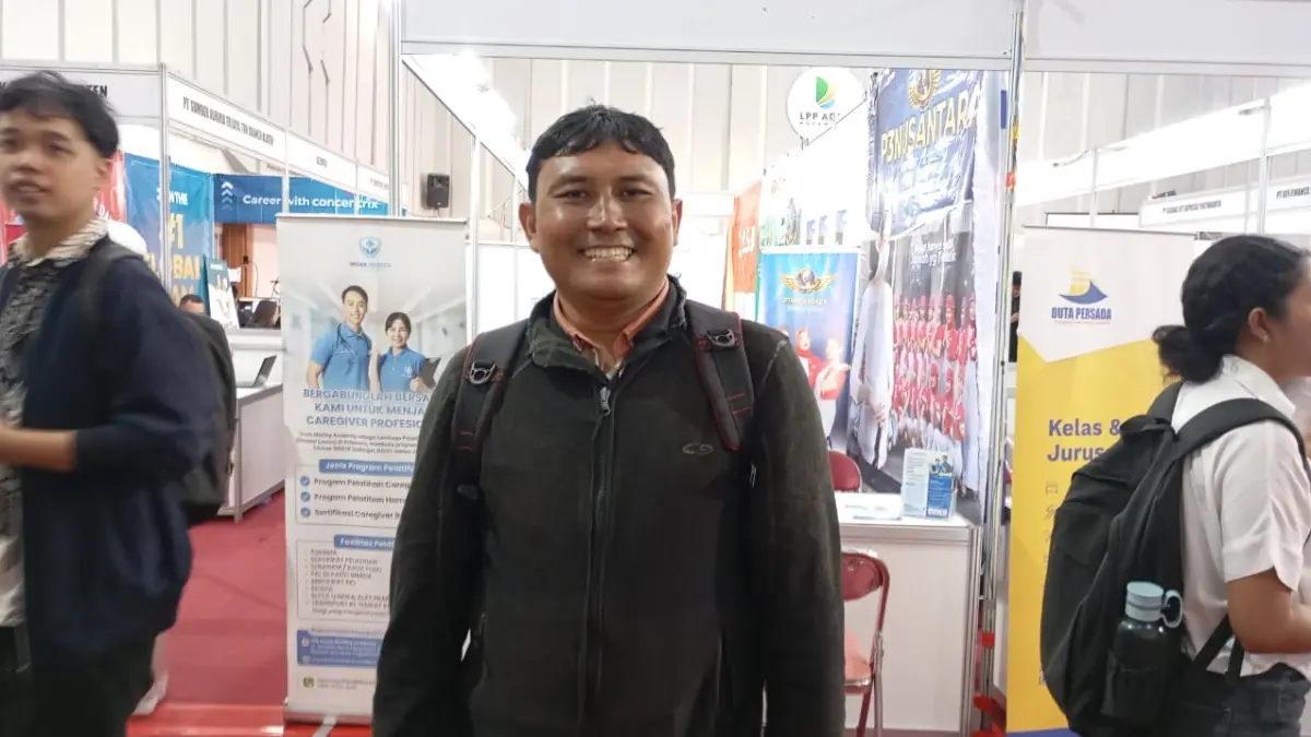 Huda Kurniawan,44 penyandang tuna rungu yang memiliki semangat untuk mencari pekerjaan di Job Fair 2026 yang diselenggarakan oleh Pemkot Jogja di Auditorium PT LPP Agro Nusantara, Rabu (15/7/2026). (Foto: IWAN NURWANTO/Radar Jogja)