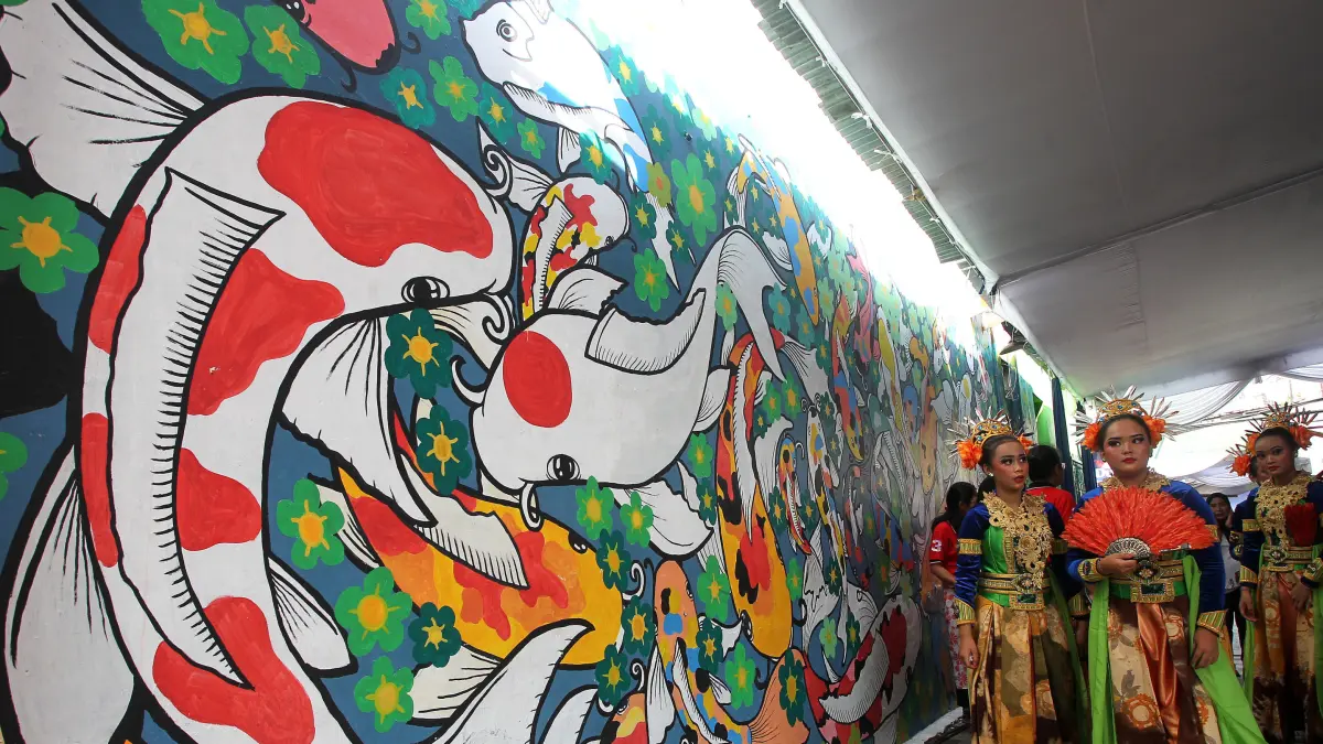 Potensial: Suasana salah satu sudut Kampung Wisata Suryatmajan, Kemantren Danurejan, Kota Jogja, yang dihiasi mural, beberapa waktu lalu. DPRD Kota Jogja mendorong Pemkot Jogja mengoptimalkan potensi setiap kelurahan untuk mempercepat pertumbuhan ekonomi dan meningkatkan kesejahteraan warga. GUNTUR AGA TIRTANA/RADAR JOGJA