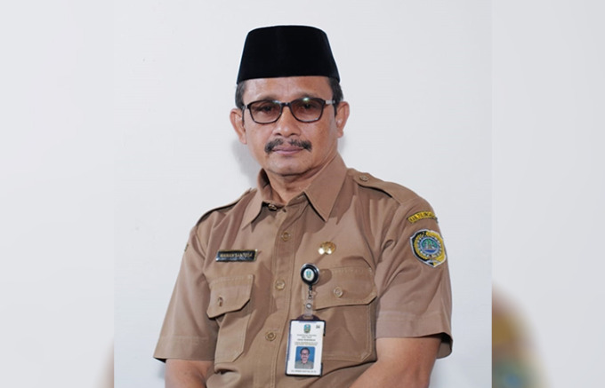 TERAMPIL: Wawan Santosa selain jadi kepala sekolah juga gemar budi daya ikan.