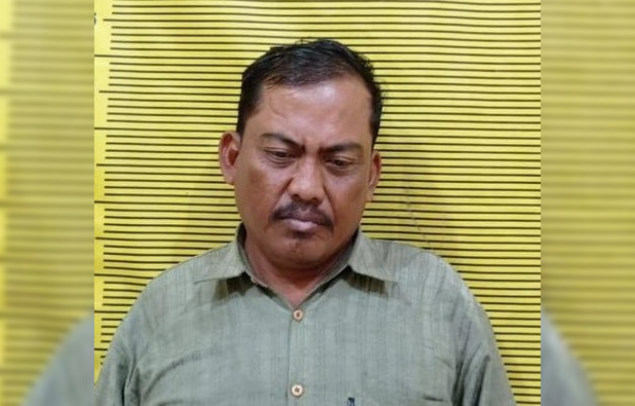 APES: Tersangka Heriyanto ditahan di Polsek Simokerto. (ISTIMEWA)