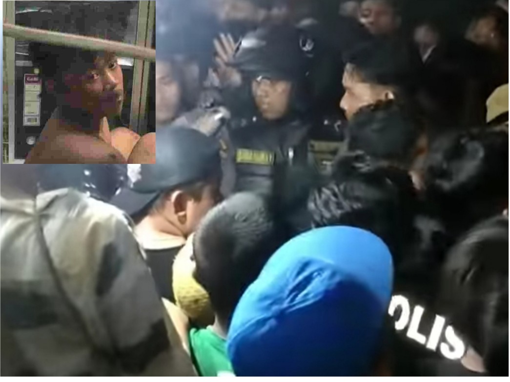Massa mengepung pelaku curanmor saat hendak dibawa ke Polsek Tenggilis Mejoyo, Surabaya, menggunakan mobil polisi (IST).