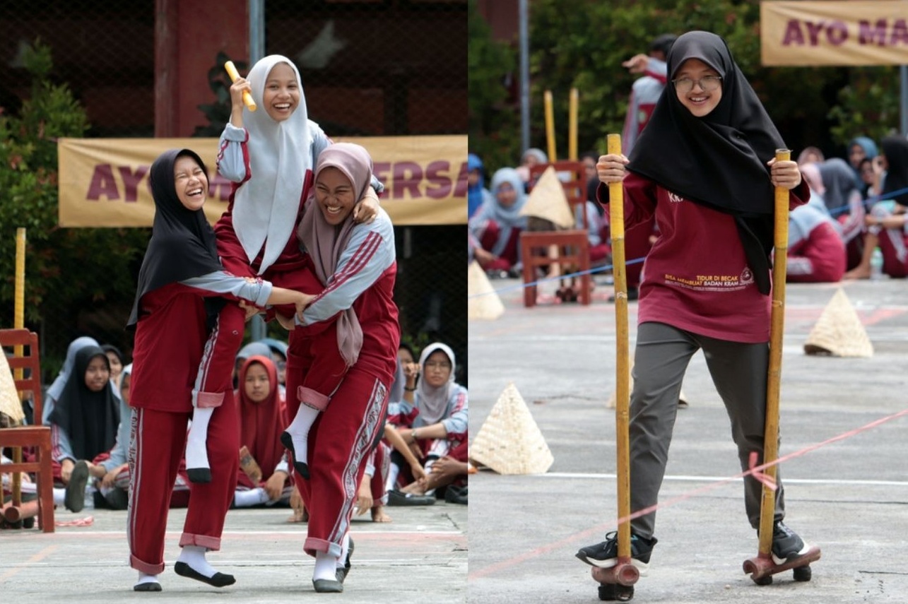 KEMBALIKAN EKSISTENSI: Sejumlah siswa di SMK Islam Al Amal Surabaya mengikuti perlombaan dengan memainkan permainan tradisional di halaman sekolah, Rabu (18/12).