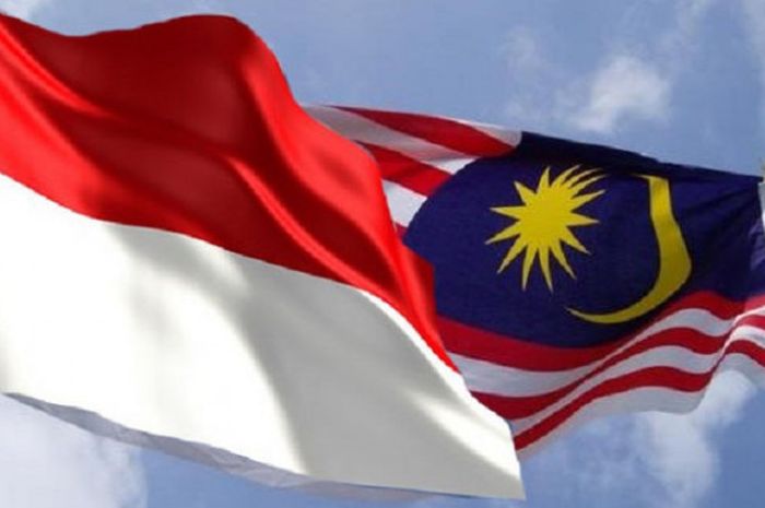 Ilustrasi bendera Indonesia dan Malaysia.