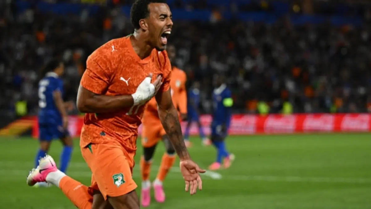 Guela Doue merayakan gol penyama kedudukan saat pertandingan persahabatan internasional [yahoo sports/Loic Venance/AFP]