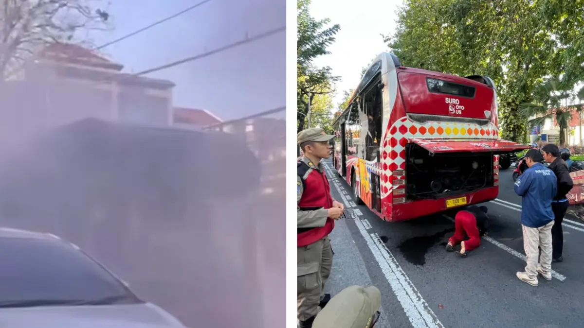 TERBATAS: Nampak asap dari Suroboyo Bus mengepul memenuhi Jalan Darmo, Surabaya. Petugas melakukan perbaikan di bagian mesin bus. (IST/RADAR SURABAYA)