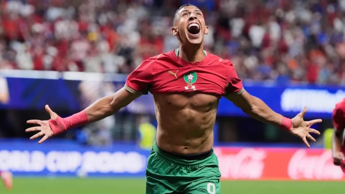 Selebrasi Soufiane Rahimi usai cetak gol ketiga Maroko. (AP Photo/Mike Stewart) 