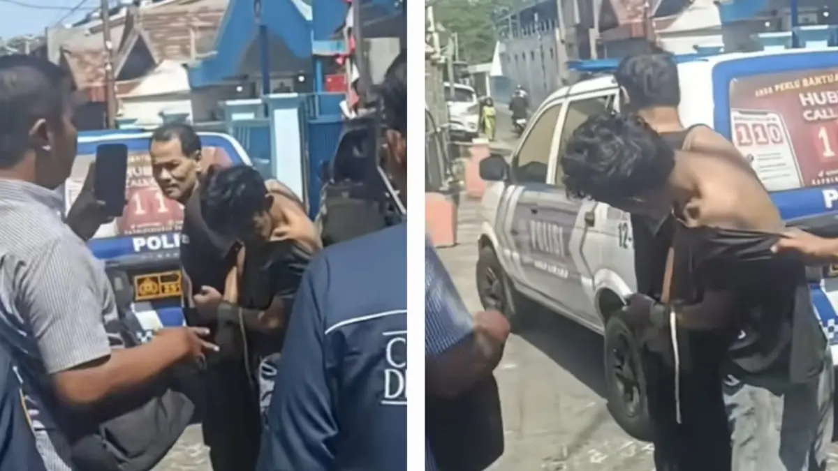 SELAMAT : Tersangka curanmor ANF pasrah dan kaos robek usai dihajar massa karena tepergok mencuri motor di Jalan Asem Jaya V, Surabaya.(IST/RADAR SURABAYA)