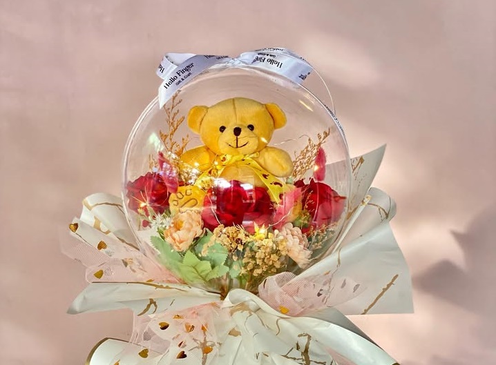 Buket balon dengan isia boneka beruang