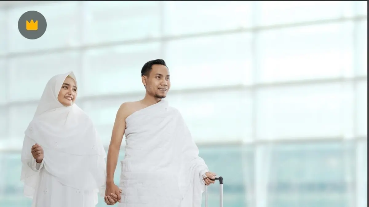 Ilustrasi sepasang suami istri saat berangkat ibadah haji