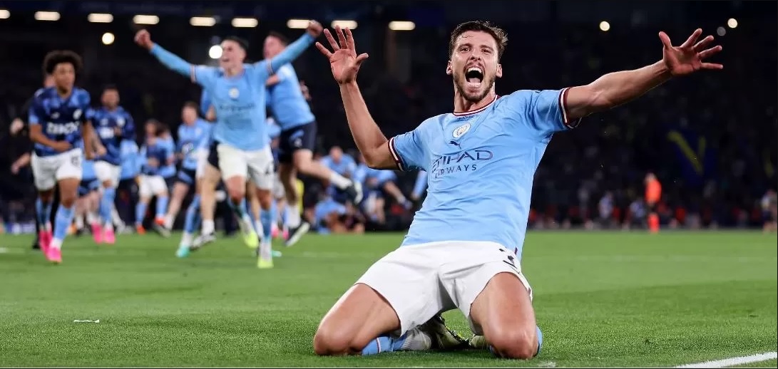 Ekspresi kegembiraan diperlihatkan Ruben Dias setelah Manchester City akhirnya keluar sebagai juara Liga Champions usai mengatasi Inter Milan 1-0. (Sportskeeda)