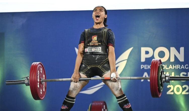 Lifter Jabar Tika Rulini raih emas angkat berat 63 kg putri.