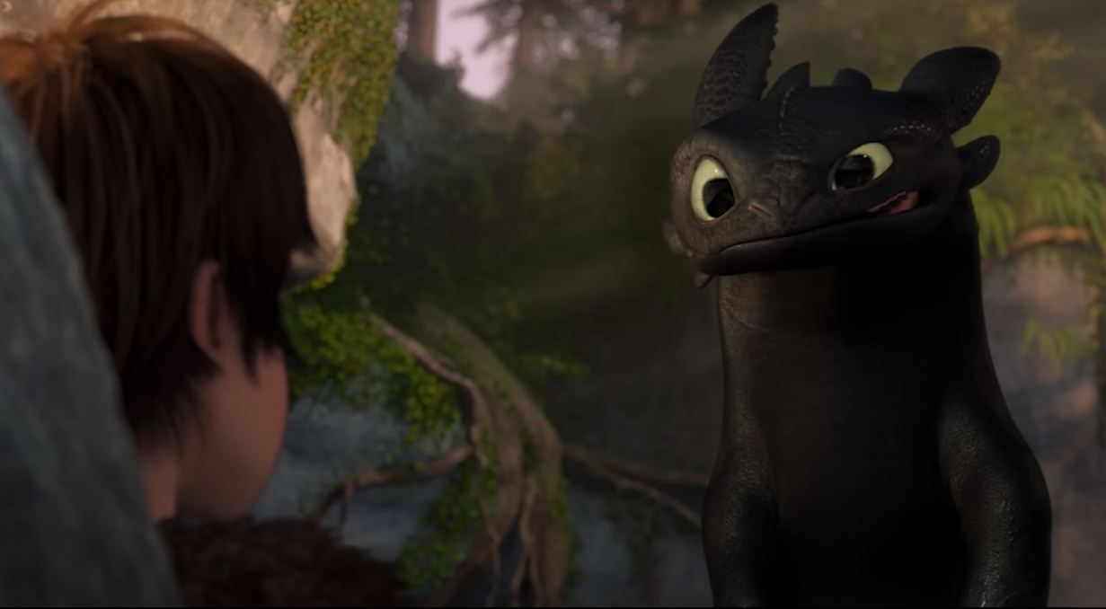 Momen awal pertemuan Hiccup dan Toothless dalam film How to Train Your Dragon.