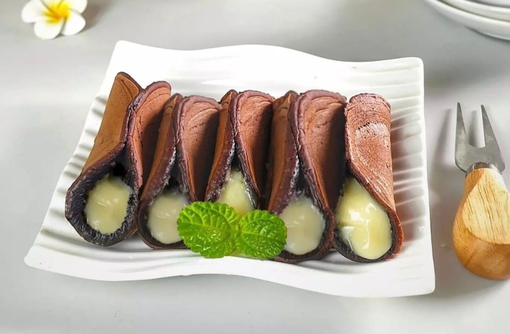 Ilustrasi kue manja cokelat vla custard.