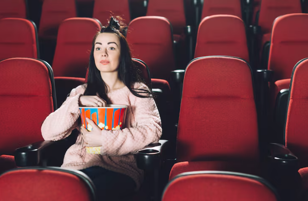 Ilustrasi duduk di kursi bioskop.