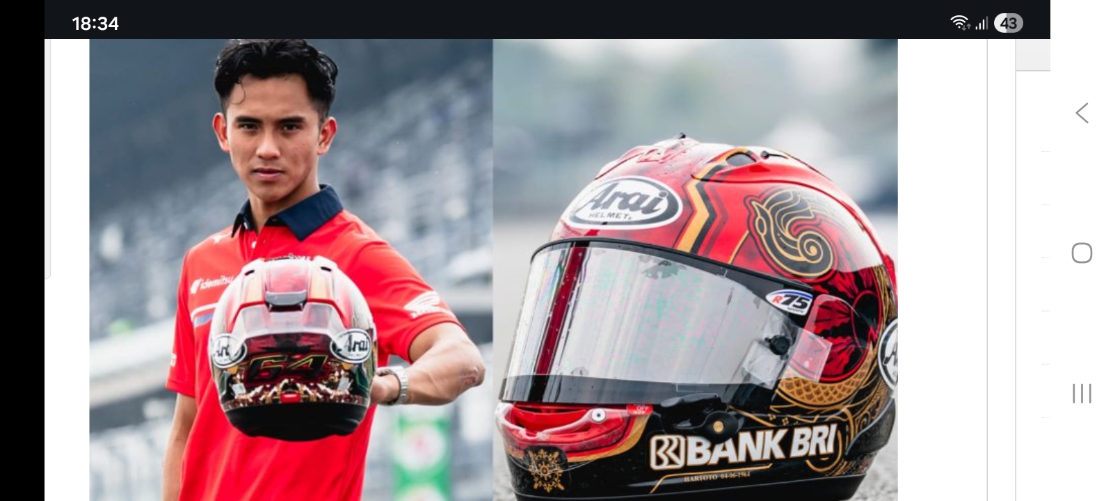 Pembalap Moto2 Mario Aji memamerkan motif batik Magetan di helmnya yang ia pakai untuk balapan.