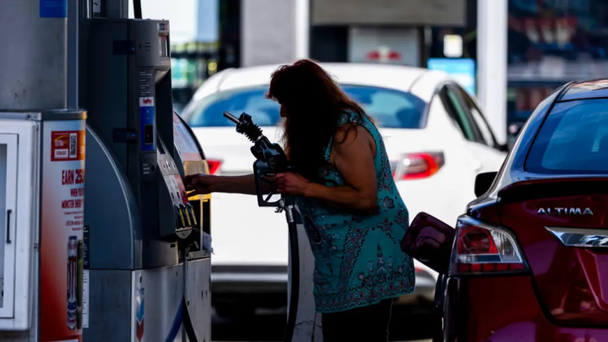 A driver refuels a vehicle with regular gasoline at a Chevron gas station in San Francisco, California, on 2 July. (The Guardian)