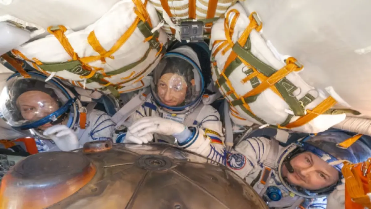 From left, NASA astronaut Chris Williams, Roscosmos cosmonaut Sergey Kud-Sverchkov, and Roscosmos cosmonaut Sergei Mikaev are seen inside the Soyuz MS-28 spacecraft after they landed in a remote area near the town of Zhezkazgan, Kazakhstan on Sunday. (CNN)