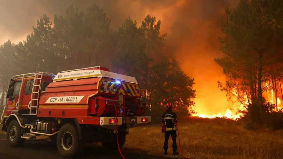 Firefighters try to extinguishing fires using a wildland water truck near Le Porge, southwestern France on July 23, 2026. (CNN)