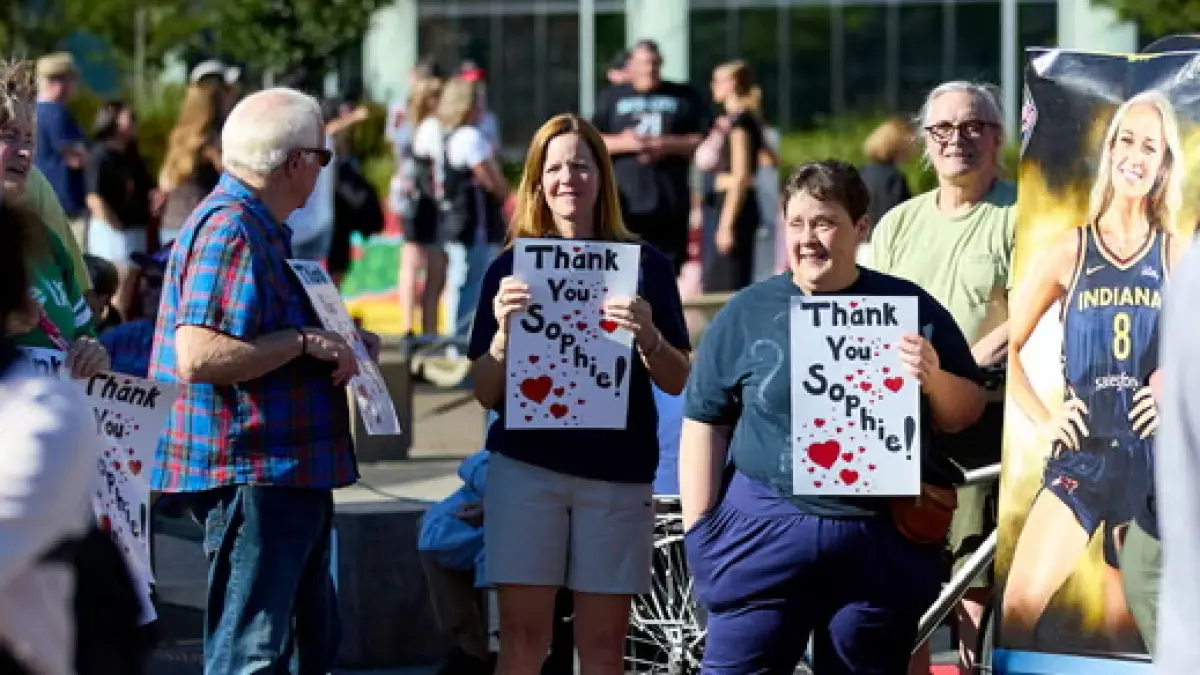 People rally to support Indiana Fever guard Sophie Cunningham after her comments on transgender athletes in women’s sports before a WNBA game between the Portland Fire and the Indiana Fever on Friday. (The Guardian)