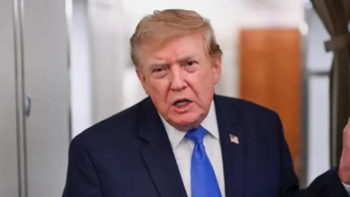 Trump speaks to reporters on Air Force One on Sunday (BBC)