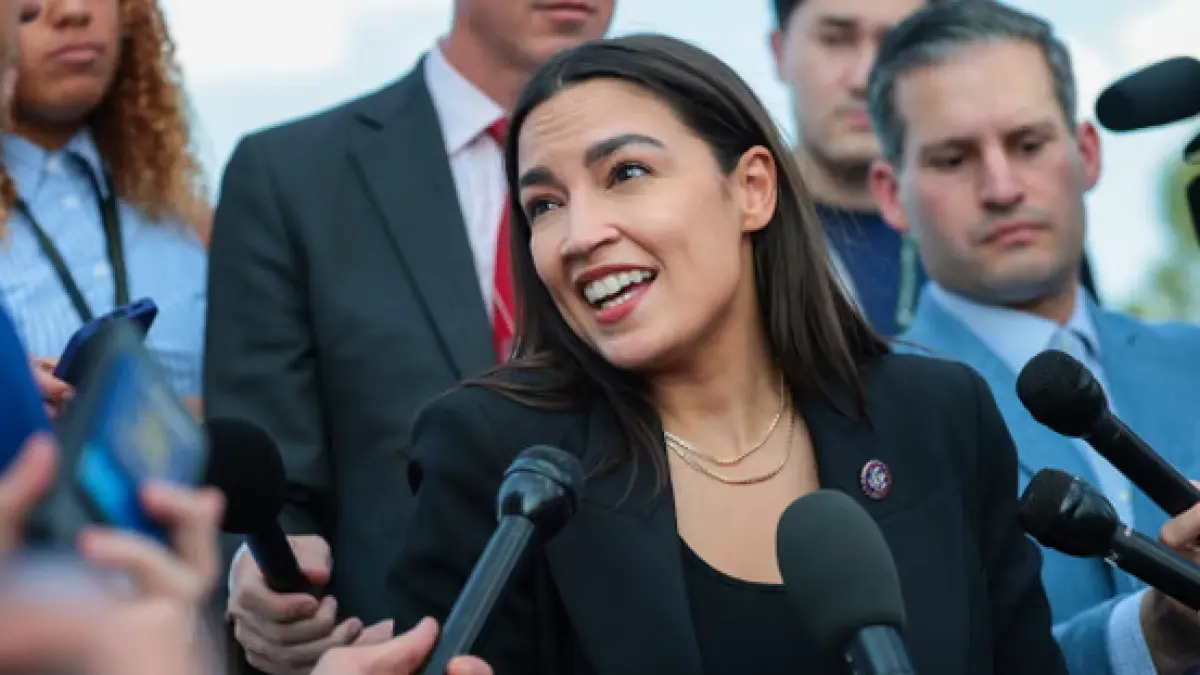 Alexandria Ocasio-Cortez on the steps of the Capitol in July. (The Guardian)