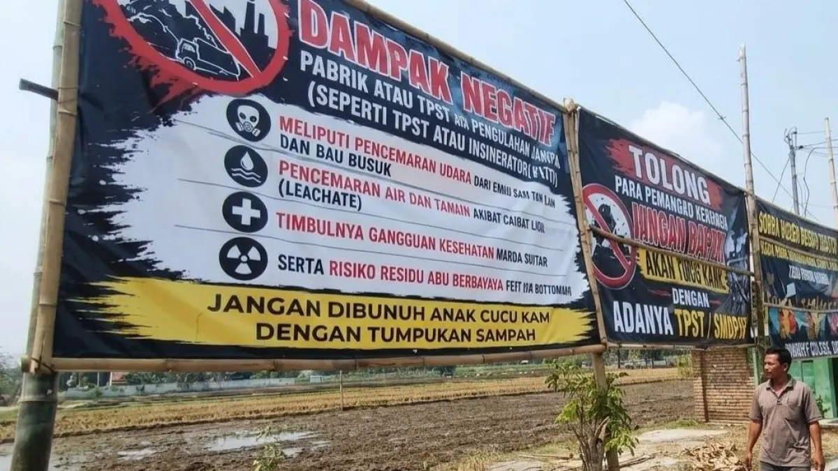 ASPIRASI: Banner penolakan rencana pengembangan TPST dipasang warga RW 07 Kelurahan Bangunsari, Kecamatan Dolopo, Kabupaten Madiun.
