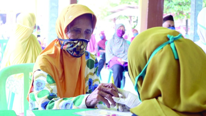 BANTUAN: Penyaluran BPNT bakal dilewatkan Kantor Pos pada tahun ini. (DOK RADAR MADIUN)