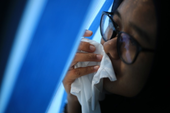 Ilustrasi mengalami gejala flu seperti demam dan pilek. (BAGAS BIMANTARA/RADAR MADIUN)