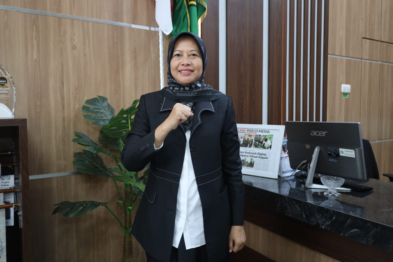 Dra Erni Qomaria Rida MPd, Kepala MTsN 1 Kota Malang.