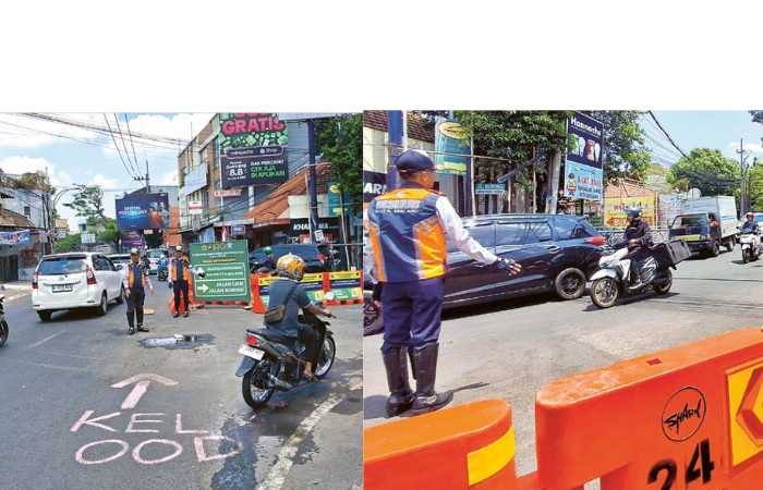 HARI PERTAMA: Petugas Dinas Perhubungan Kota Malang membantu mengarahkan pengendara dari Jalan Brigjen Slamet Riyadi menuju Jalan Buring kemarin (2/9).