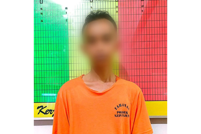 TERTANGKAP: M. Ali Fauzi, 34, warga Arjowinangun, Kecamatan Kedungkandang, Kota Malang setelah ditahan di Polsek Kepanjen. (POLRES MALANG FOR RADAR KANJURUHAN)