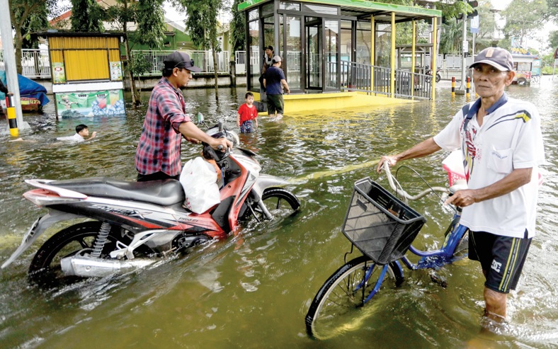 CUKUP PARAH: Desa Morowudi, Kecamatan Cerme, menjadi wilayah terdampak luapan Kali Lamong paling parah kemarin (4/3).