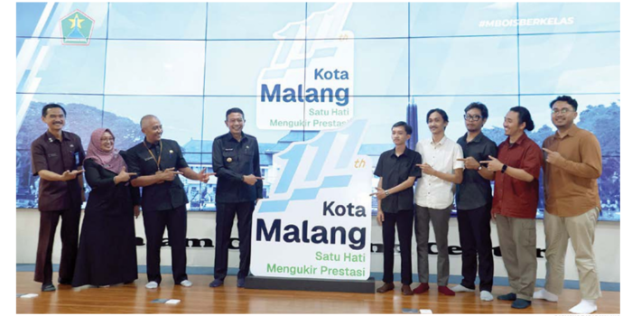 USUNG KEBERSAMAAN: Logo HUT Ke-111 Kota Malang diresmikan di NCC (20/3). Usung tema Satu Hati Mengukir Prestasi yang bermakna merepresentasikan semangat kebersamaan. (DARMONO/RADAR MALANG)