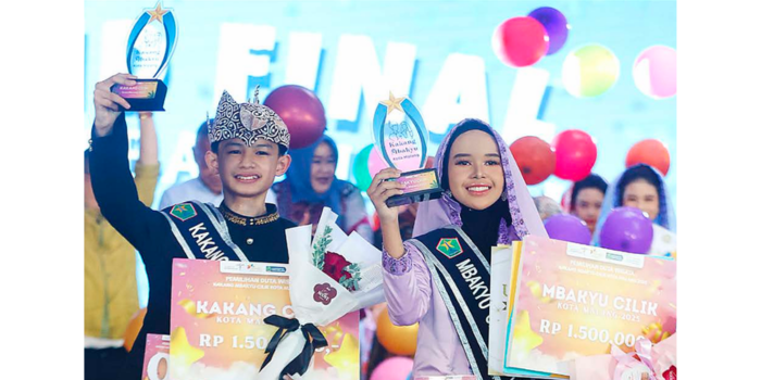 Fahreza Danenda al-Ghifari, siswa kelas 6 Sd Insan Amanah (kiri) dan aiko Nadhifa Anayah Hartanto, siswi kelas 6 Sd Anak Saleh menjadi pemenang dalam ajang Kakang Mbakyu Cilik 2025.