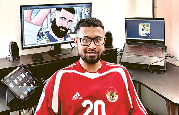 BERAWAL DARI HOBI: Finendi Ramadhani Wardhana berpose di depan ilustrasi eks pemain Real Madrid Karim Benzema hasil buatannya.