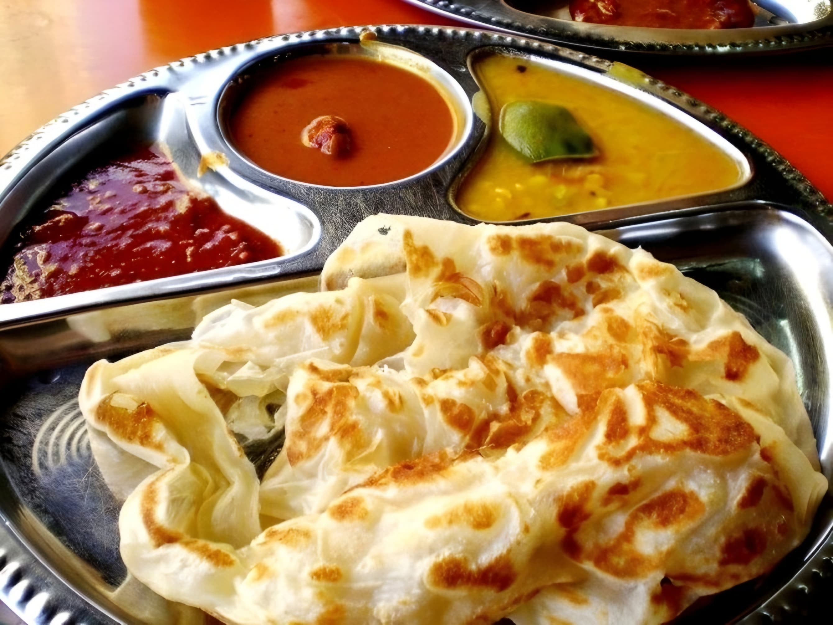 LEZAT: Roti canai dengan tekstur empuk dan gurih siap jadi teman santai di berbagai sudut Malang