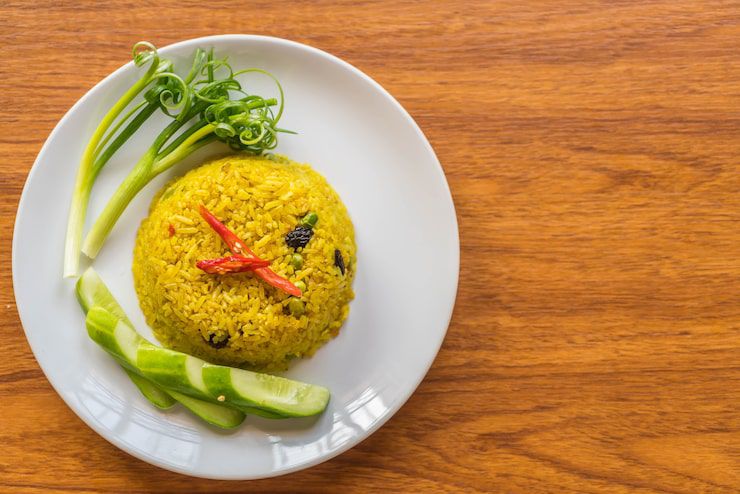 GURIH REMPAH: Nasi kuning, makanan favorit warga untuk sarapan.