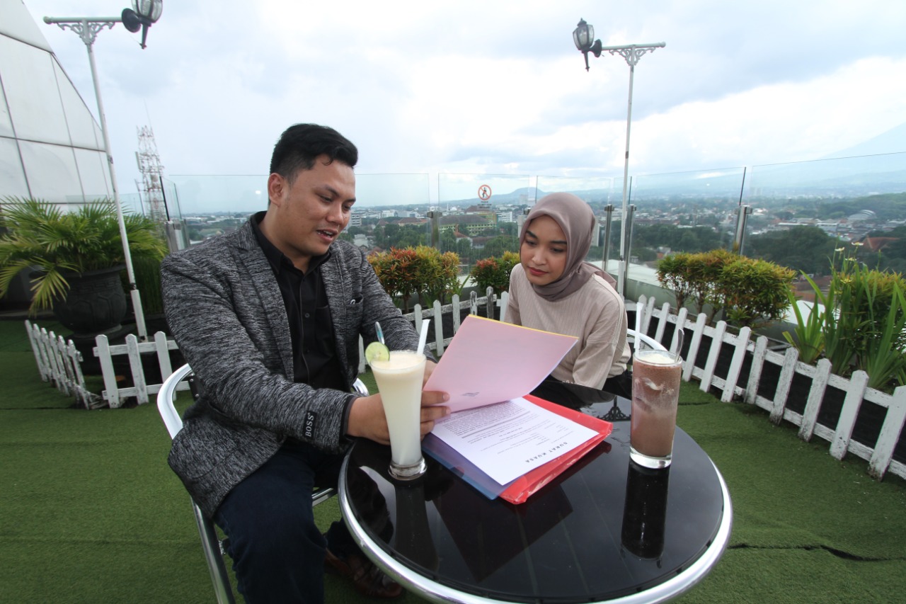 Didik Lestariyono (kiri)  (Rofia Ismania / Radar Malang)