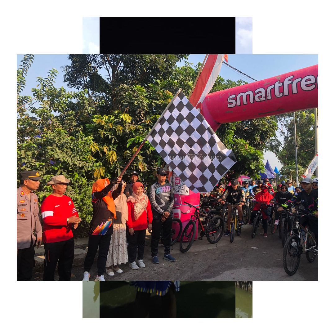 SEMANGAT: Bupati Ikfina Fahmawati memberangkatkan ratusan peserta Fun Bike Festival Bicak dari titik start di Lapangan Desa Bicak, Minggu (10/9).