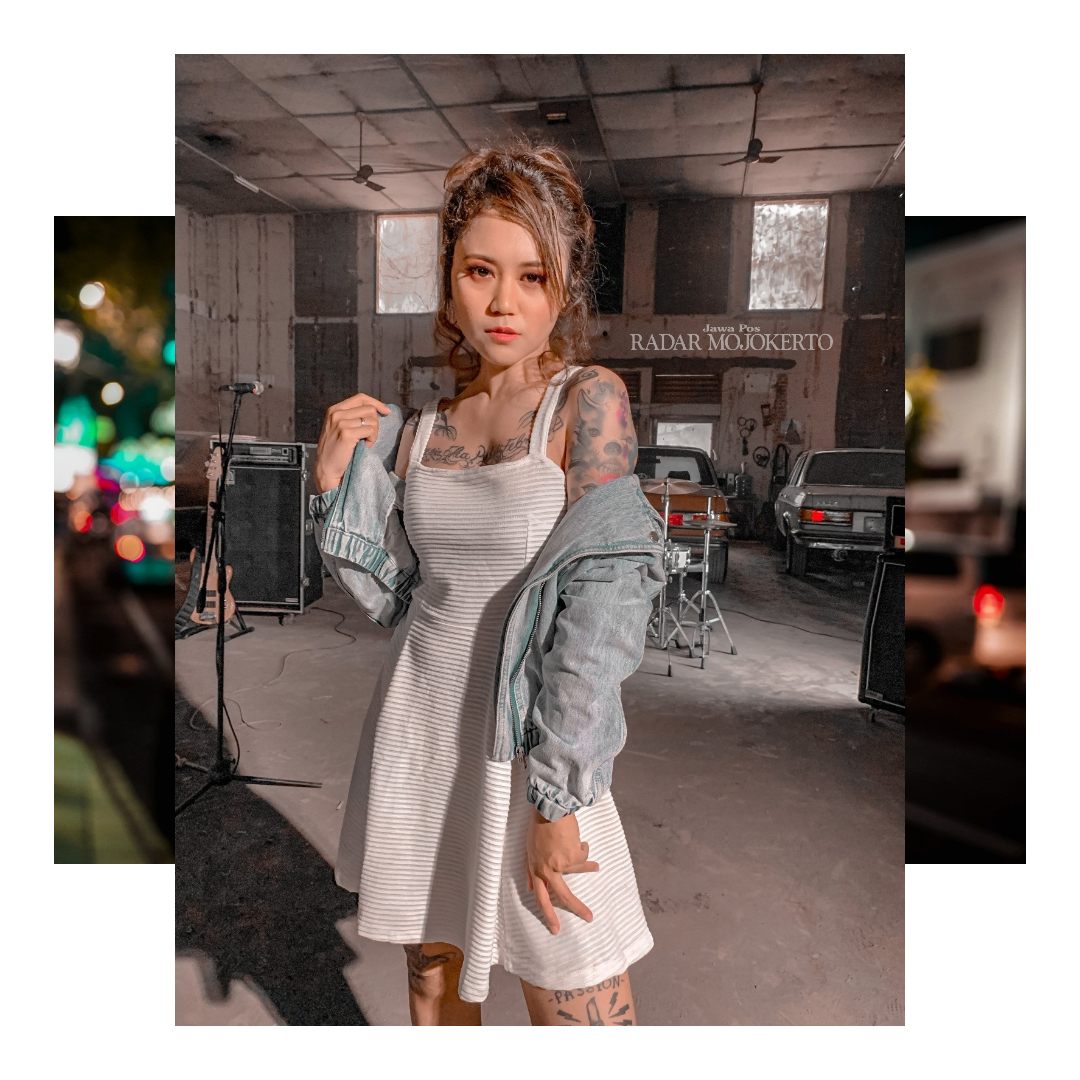 KETAGIHAN: Agnes Magdalena yang mulai menato tubuhnya sejak 2011, kini sudah memiliki 18 tato di sekujur tubuhnya.