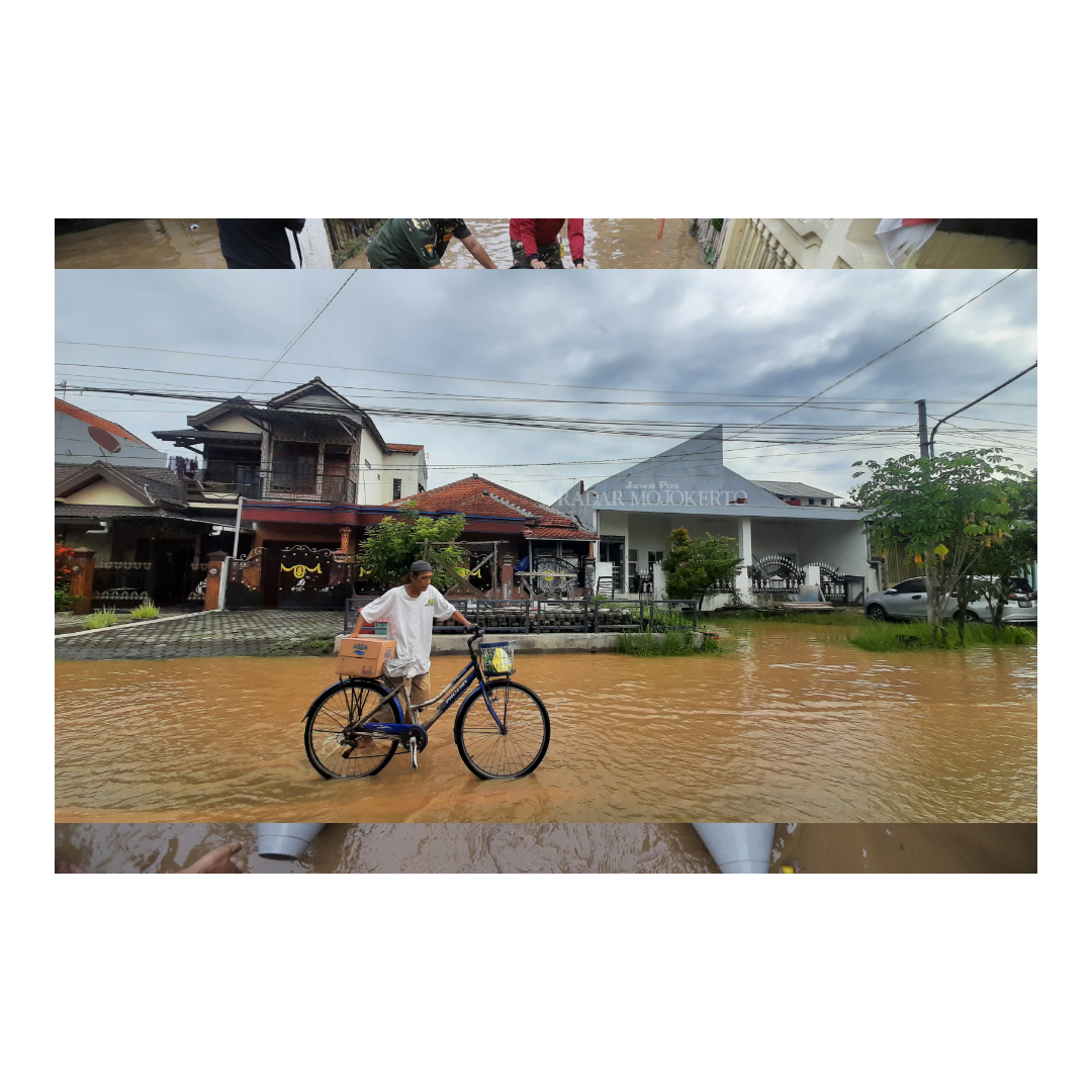 MENGGENANG: Warga melintas di daerah yang masih tergenangi banjir di Kecamatan Prajurit Kulon, Kota Mojokerto, Minggu (11/3).