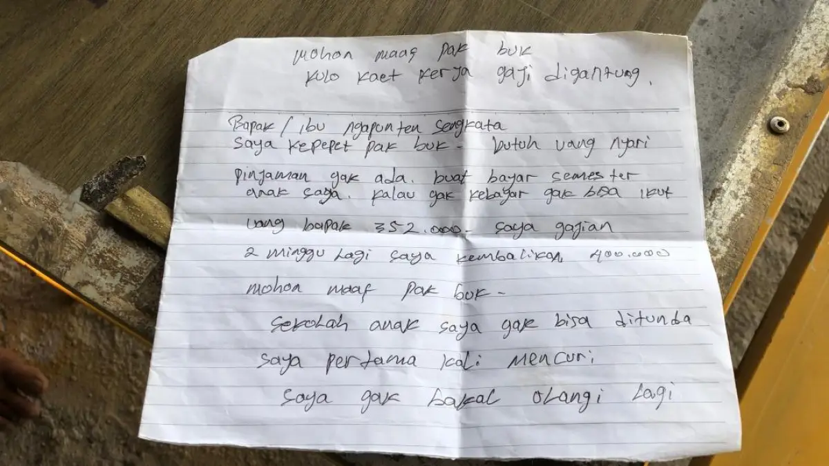 Sepucuk surat tulisan tangan yang ditinggalkan terduga pencuri usai menggasak uang toko. 