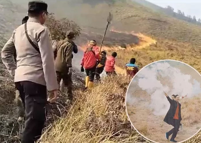 Petugas berada di bukit teletubbies yang terbakar akibat flare foto prewedding pengunjung.