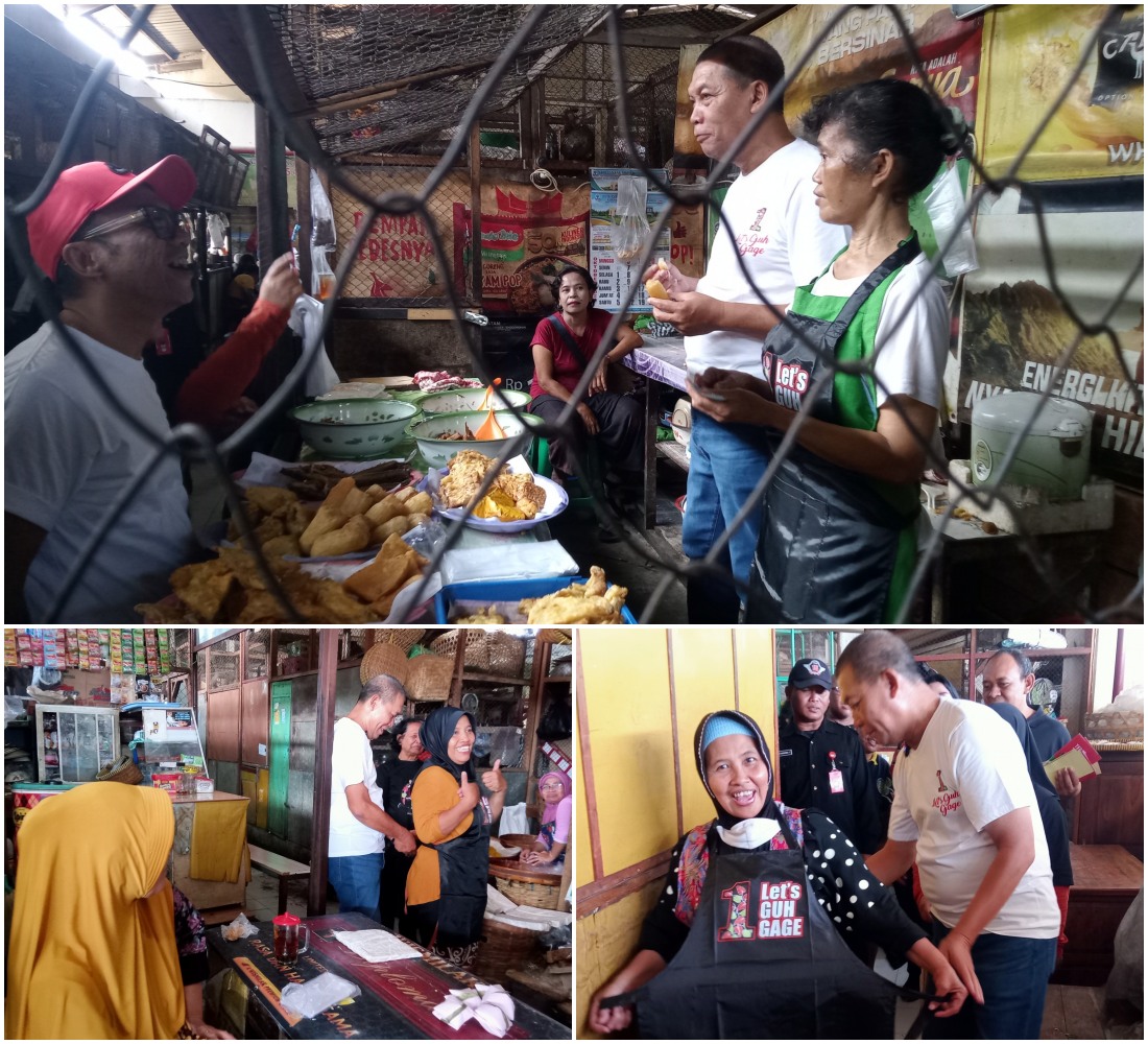 Teguh Prakosa dan Bambang Nugroho berbagi celemek kepada pedagang Pasar Nusukan, Senin (28/10/2024).