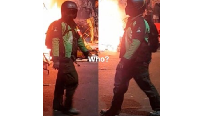 Sosok pria misterius berjaket ojol dan sepatu Adidas Terrex yang muncul saat pembakaran Gedung Negara Grahadi, Surabaya.
