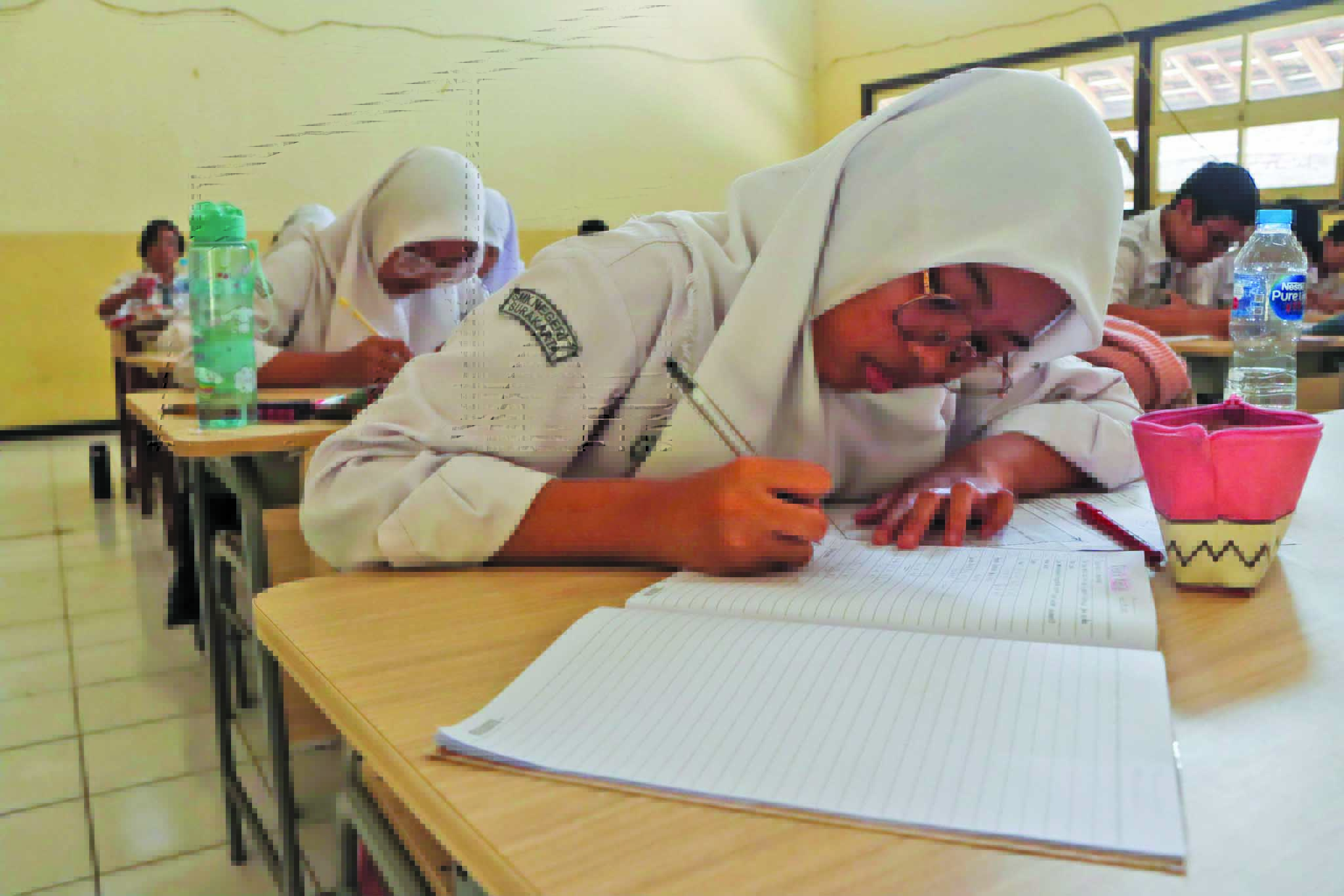 ATURAN BARU: Kegiatan belajar mengajar di salah satu SMK negeri di Kota Solo, belum lama ini. Tes kemampuan akademik akan menggantikan ujian nasional kelas XII SMA/SMK.
